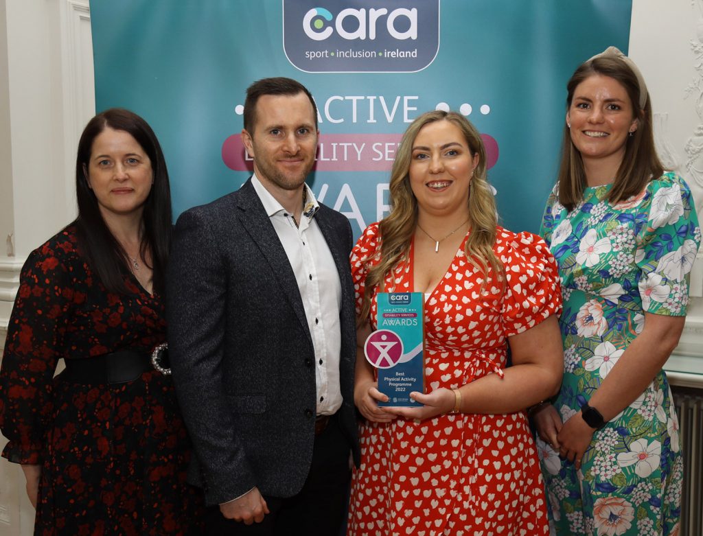 Niall Molloy and Lauren Watters from Stewarts Care with Cara staff